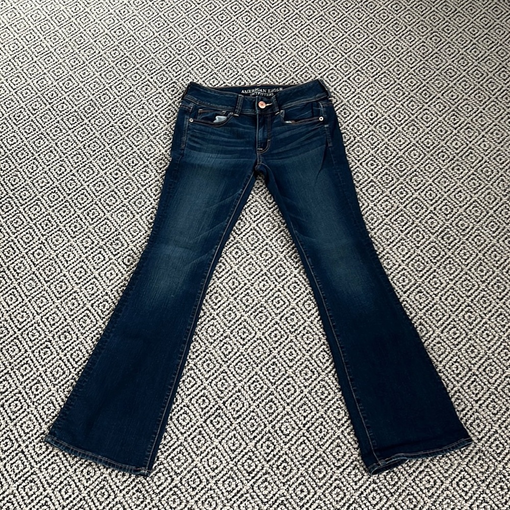 selling American Eagle super stretch kick boot jeans for 24 dollars.